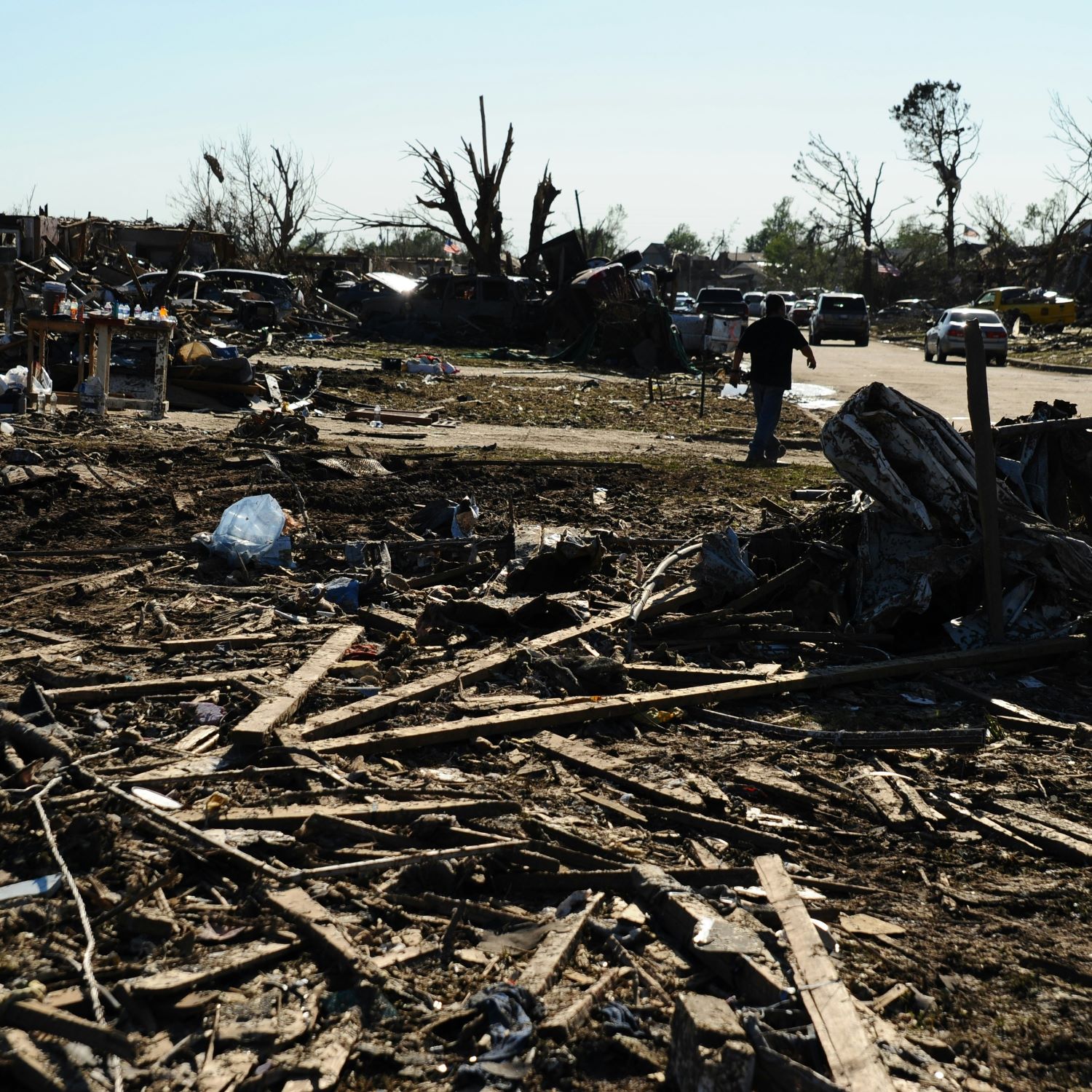 Clean up occurs in a neighborhood after a weather-related disaster