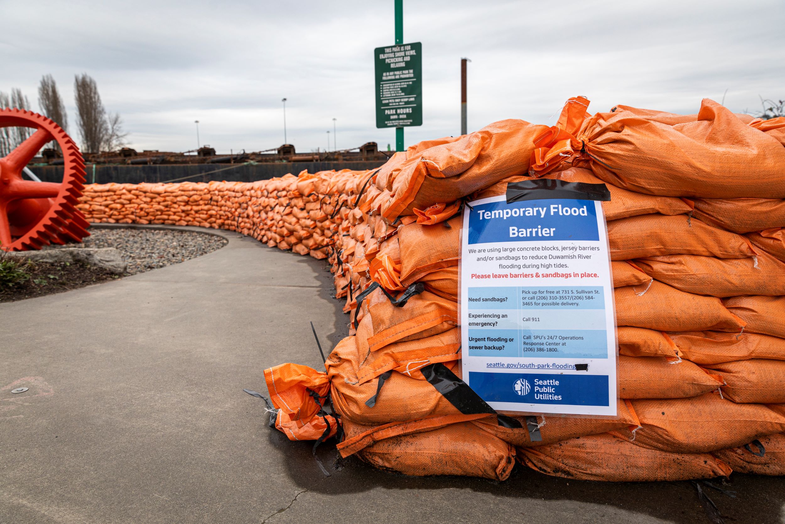 Sandbags are stacked for form a temporary flood barrier