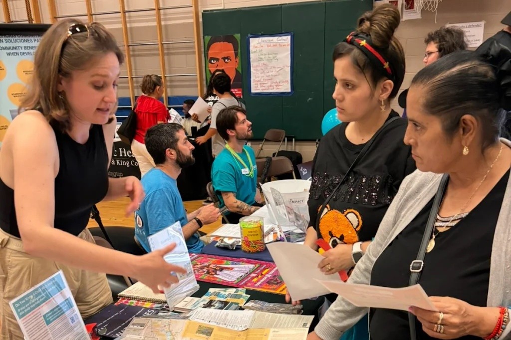 A UW researcher talks to members of the community