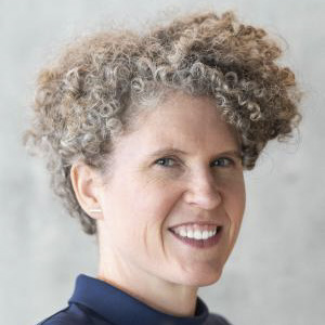 Image of Joan Casey, who is wearing a blue turtleneck