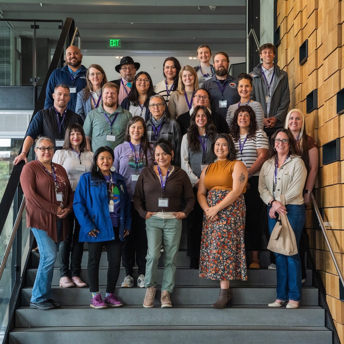 All of the institute attendees pose for the camera while standing on a stairwell